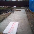 Фундамент на забивных ж/б сваях с бетонным ростверком для хозяйственной постройки из бруса с гаражом и подвалом в городе Грязи Липецкой области от компании 35FS