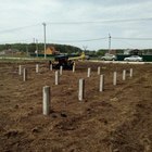 Фундамент на забивных ж/б сваях для дома из оцилиндрованного бревна в коттеджном поселке Московской области от компании 35FS