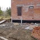 Фундамент на забивных ж/б сваях с обвязкой швеллером для крыльца и террасы к кирпичному дому в поселке Родник Томской области от компании 35FS