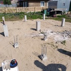 Фундамент на забивных ж/б сваях для дома из бруса с фундаментом под печь в деревне Березкино Томской области от компании 35FS