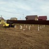 Фундамент на забивных ж/б сваях для дома из оцилиндрованного бревна в коттеджном поселке Московской области от компании 35FS
