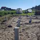 Фундамент на забивных ж/б сваях для дома из бруса с террасой в селе Зоркальцево Томской области от компании 35FS